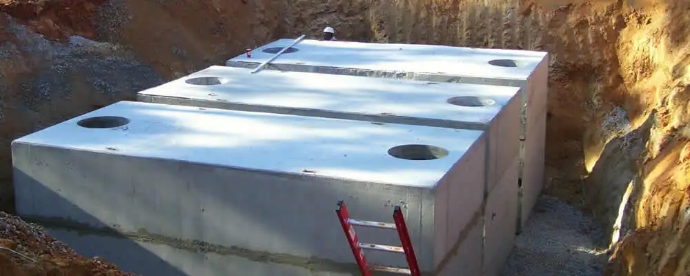 Septic tank installation site with a newly placed concrete tank in Arlington, TX